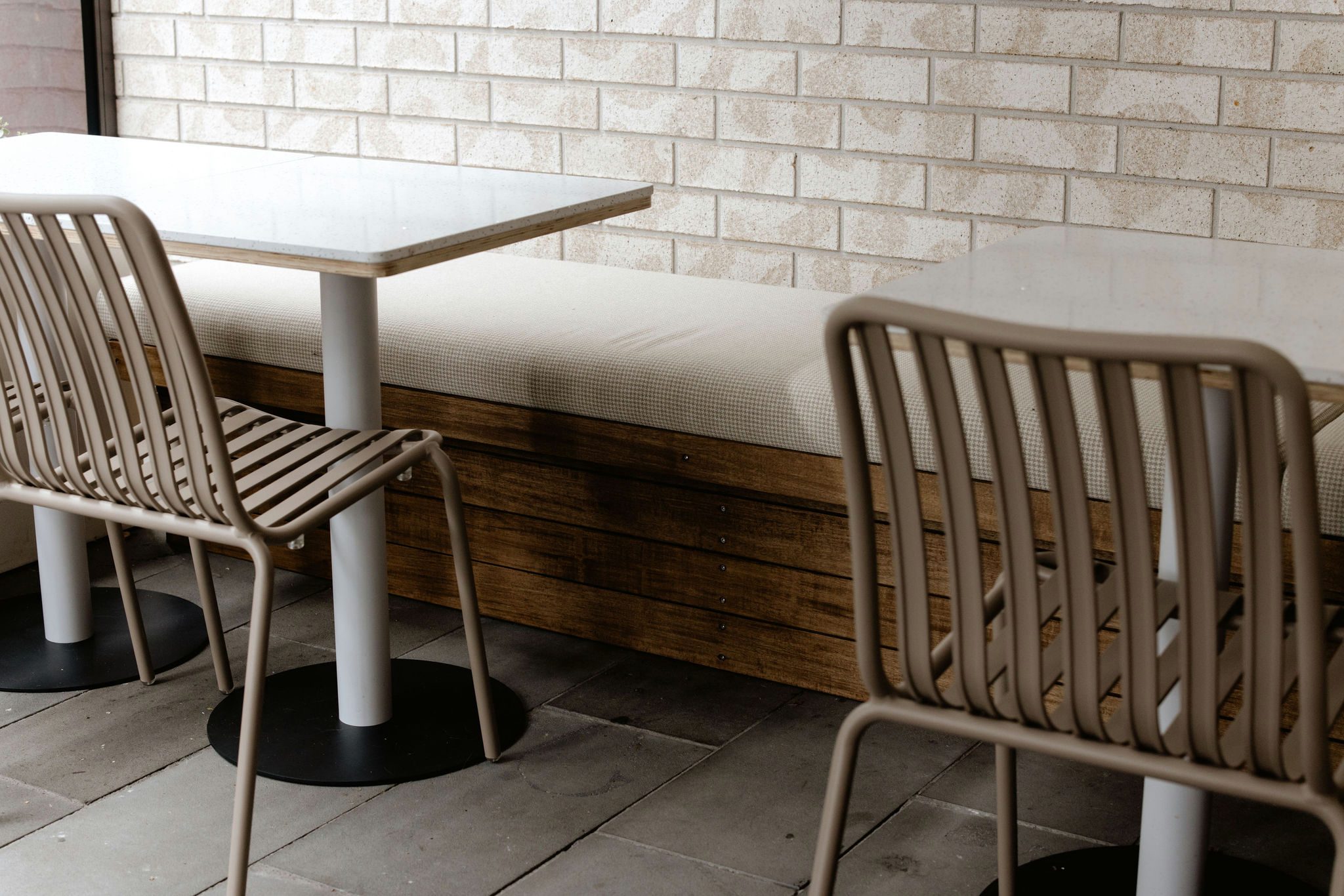 Landscape view of outdoor café seating with Vitex decking